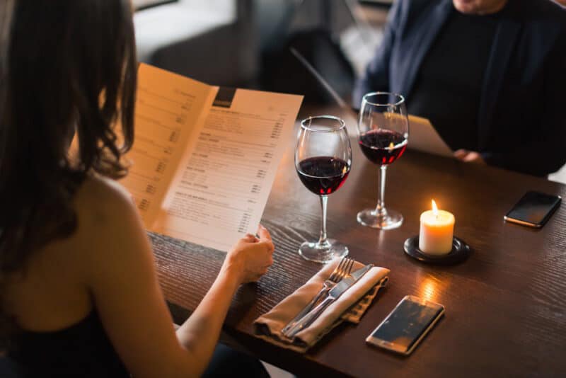 couple viewing menu at classy restaurant