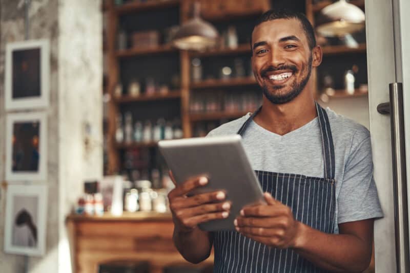 man holding tablet in restaurant