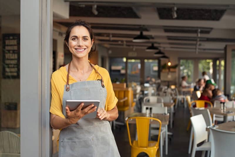 restaurant owner using software on tablet