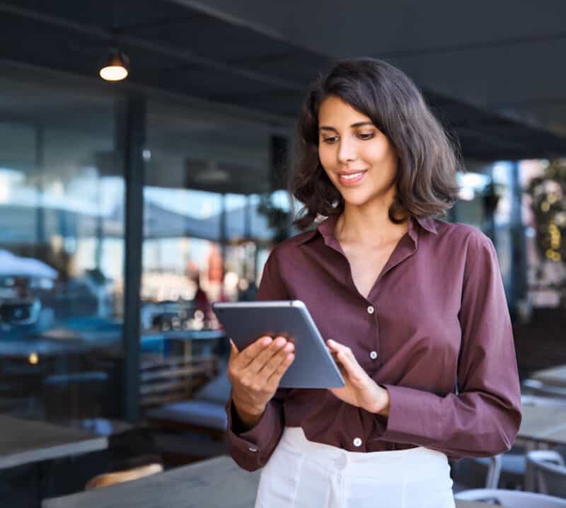 restaurant owner looking at tablet