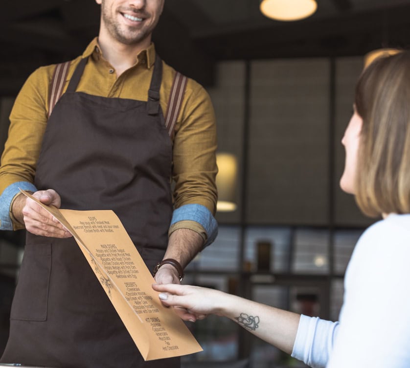 woman ordering from a restaurant menu