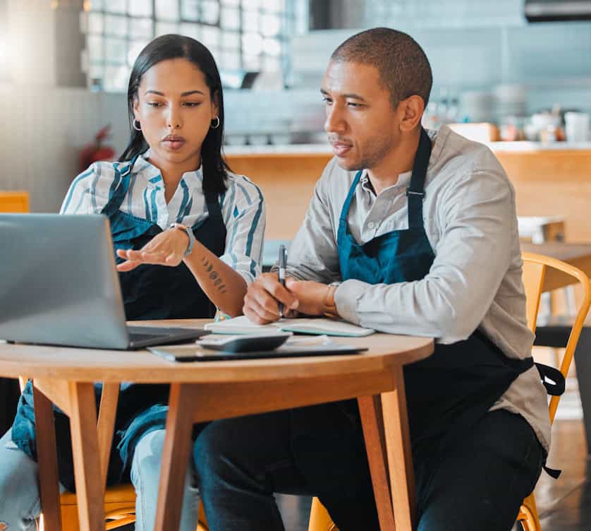 restaurant owners working on a menu