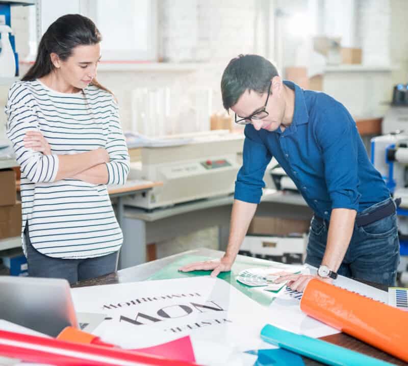 business owners reviewing print materials